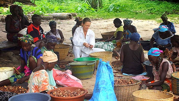 Women sorting nuts in a village, Guinea-Bissau