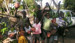 Children carrying seedlings