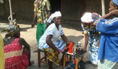 Women testing a manual oil expeller