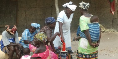 Women testing oil expeller